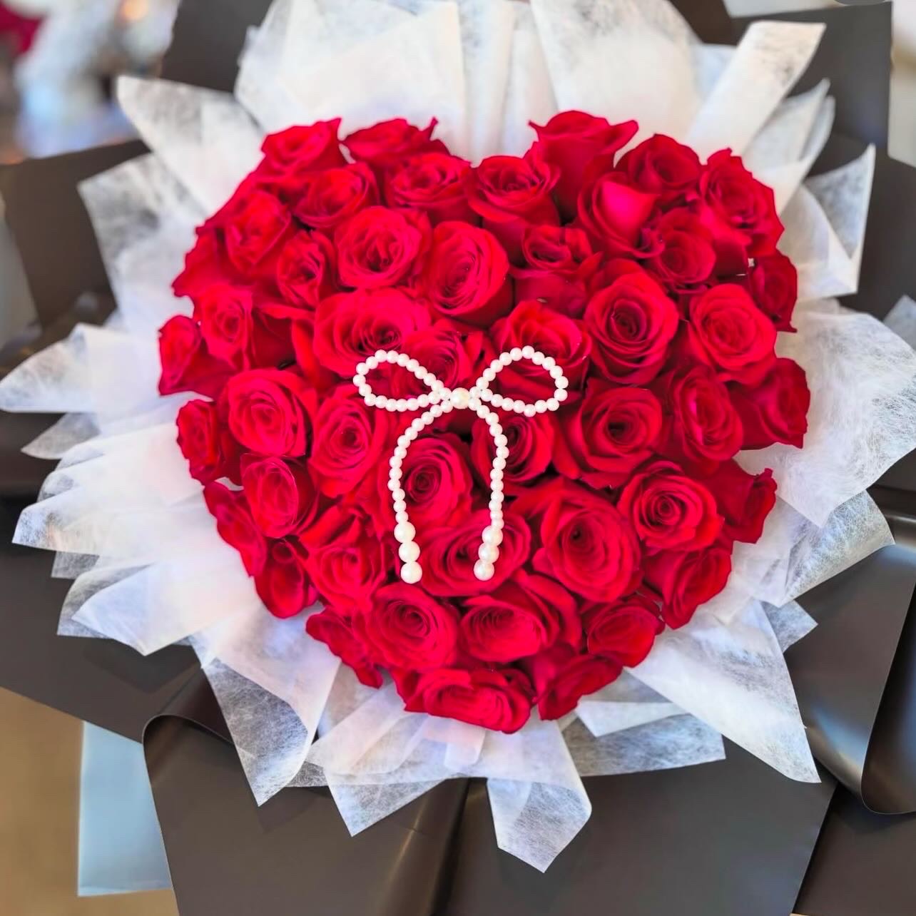 Elegant Heart-Shaped Red Rose Arrangement with Pearl Bow