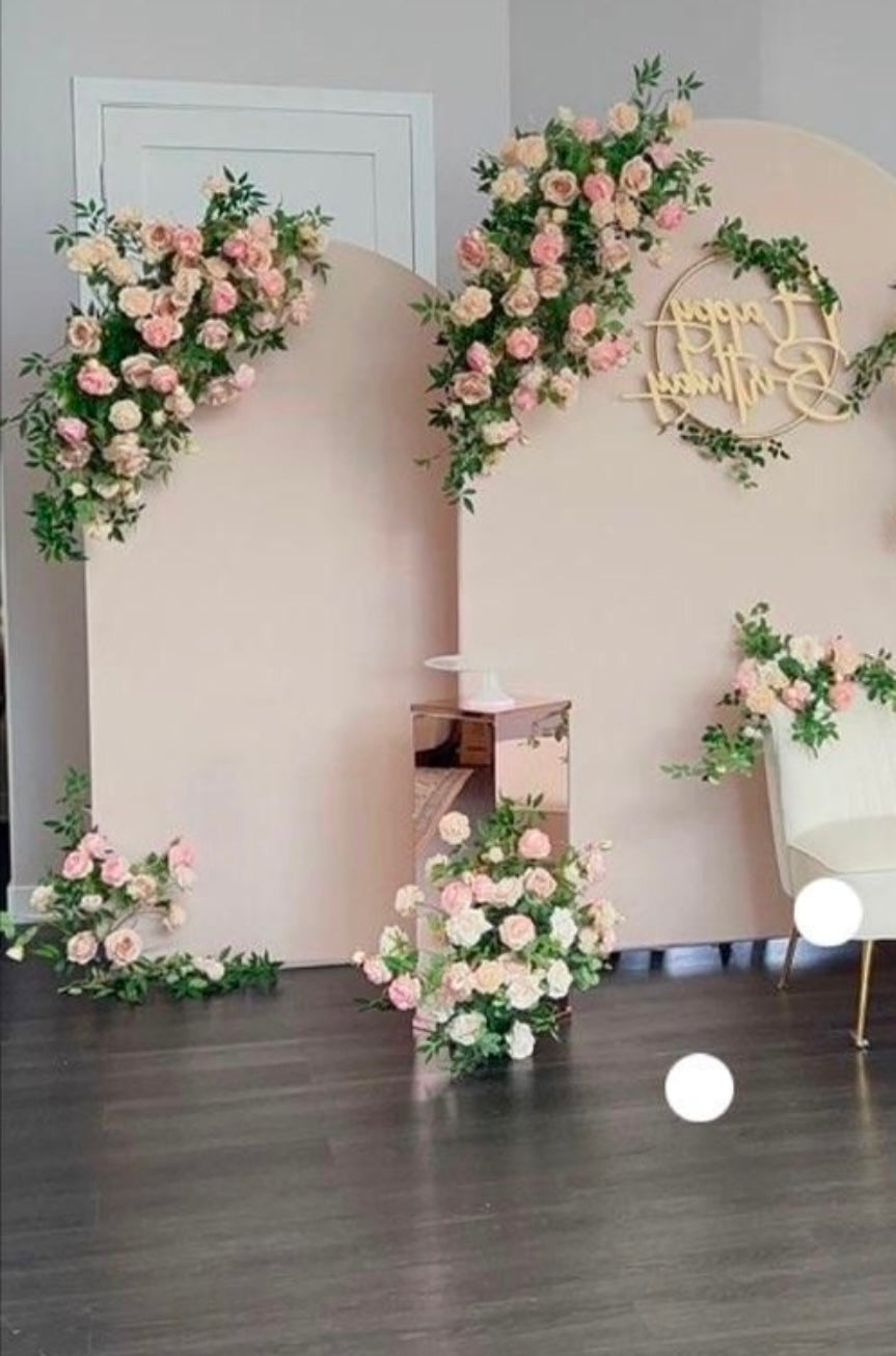 Elegant Floral Arrangement on Top of Backdrop