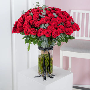 Valentines 100 red roses in a vase