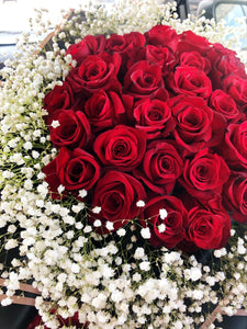 Red roses with baby breath